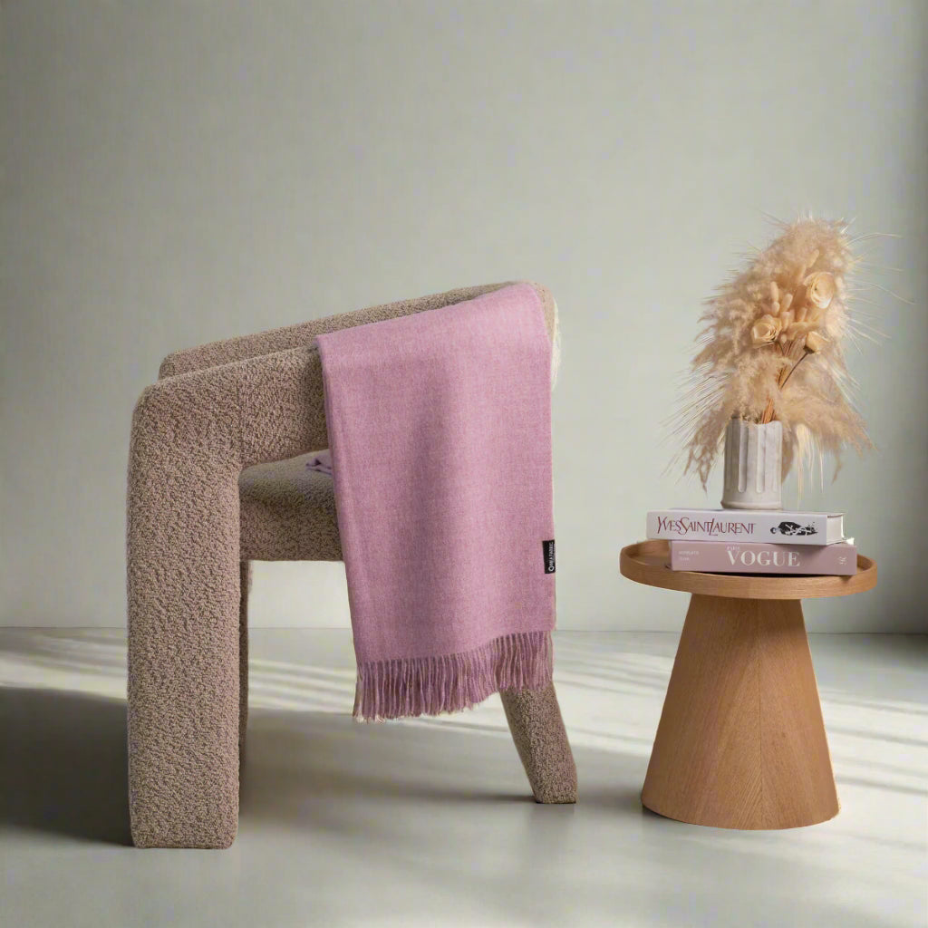 a alpaca blanket in a grey chair 